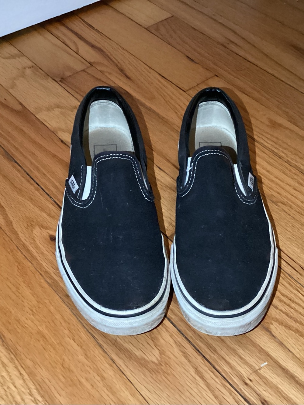 Vans Black and White Slip-On Sneakers